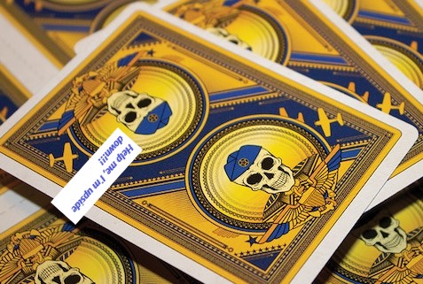 I am a Hellcat card back with an upside down skull.jpg
